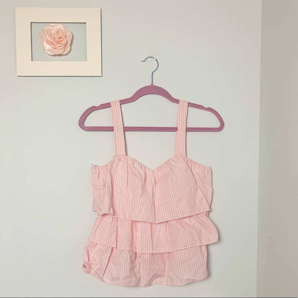 A striped soft pink ruffle tank